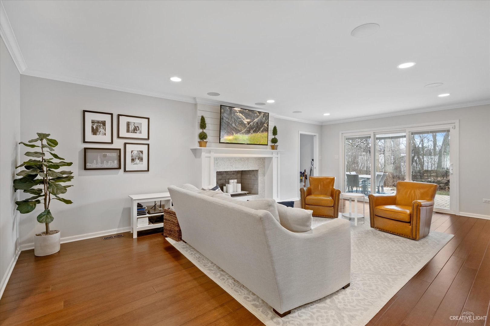734 Forest Glen Lane Oak Brook, IL 60523 - Photo 11 of 36 a living room with furniture fireplace and window