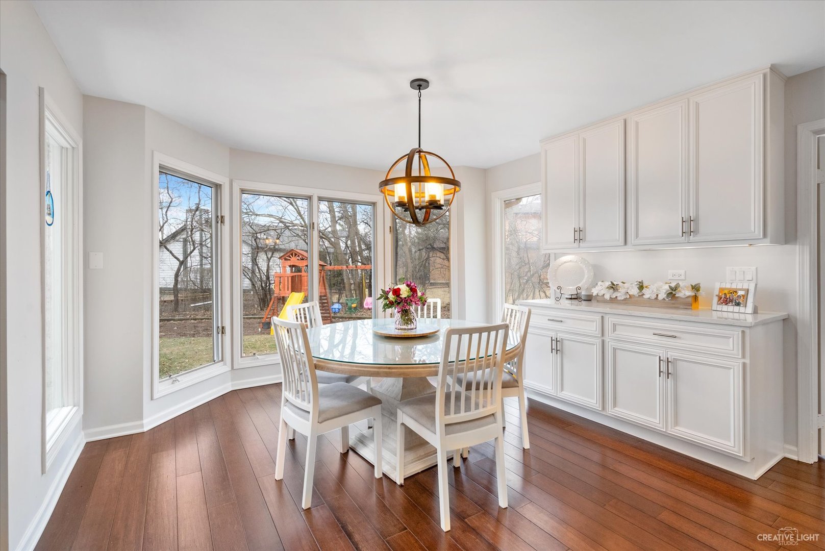 734 Forest Glen Lane Oak Brook, IL 60523 - Photo 18 of 36 a dining room with furniture window wooden floor