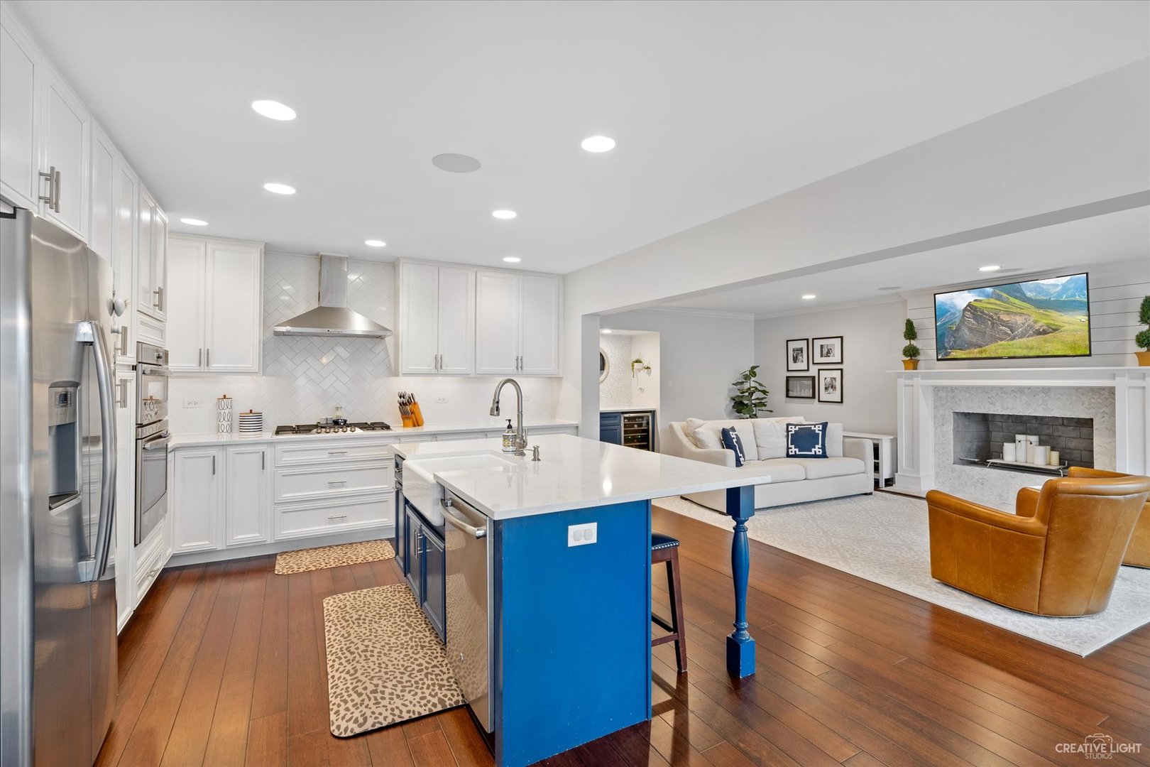 734 Forest Glen Lane Oak Brook, IL 60523 - Photo 19 of 36 a large kitchen with kitchen island a stove a sink a refrigerator and cabinets
