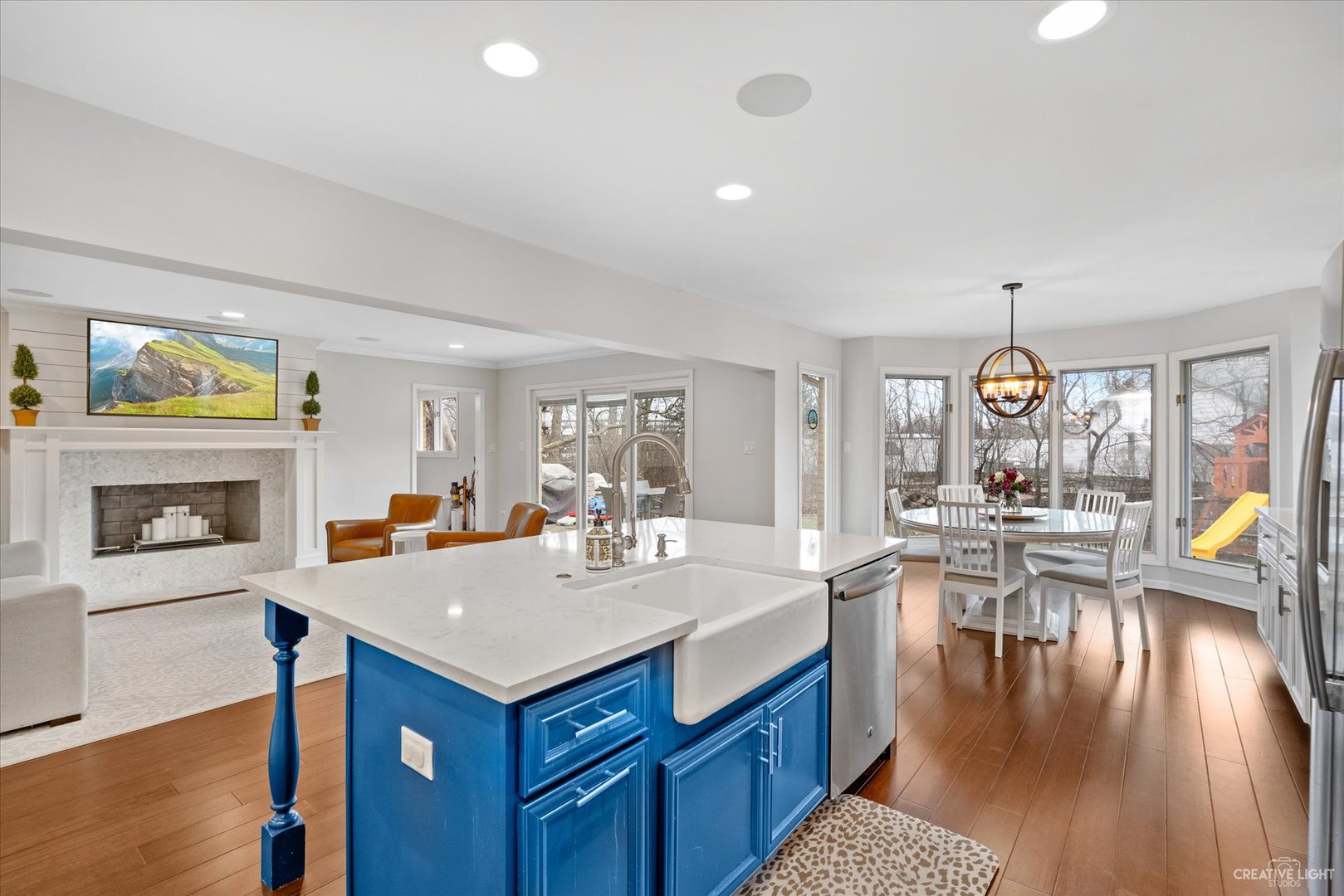 734 Forest Glen Lane Oak Brook, IL 60523 - Photo 21 of 36 a view of living room with granite countertop furniture and fireplace