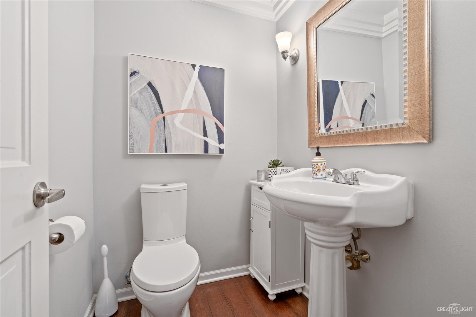 734 Forest Glen Lane Oak Brook, IL 60523 - Photo 23 of 36 a bathroom with a toilet sink and mirror