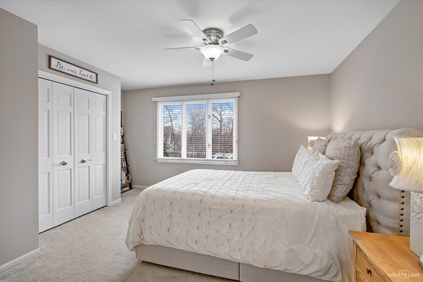 734 Forest Glen Lane Oak Brook, IL 60523 - Photo 24 of 36 a bedroom with a large bed and a chandelier
