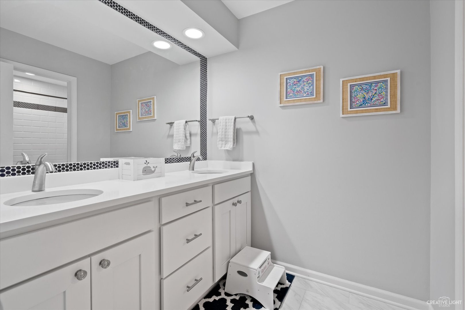 734 Forest Glen Lane Oak Brook, IL 60523 - Photo 33 of 36 a bathroom with a double vanity sink and a mirror