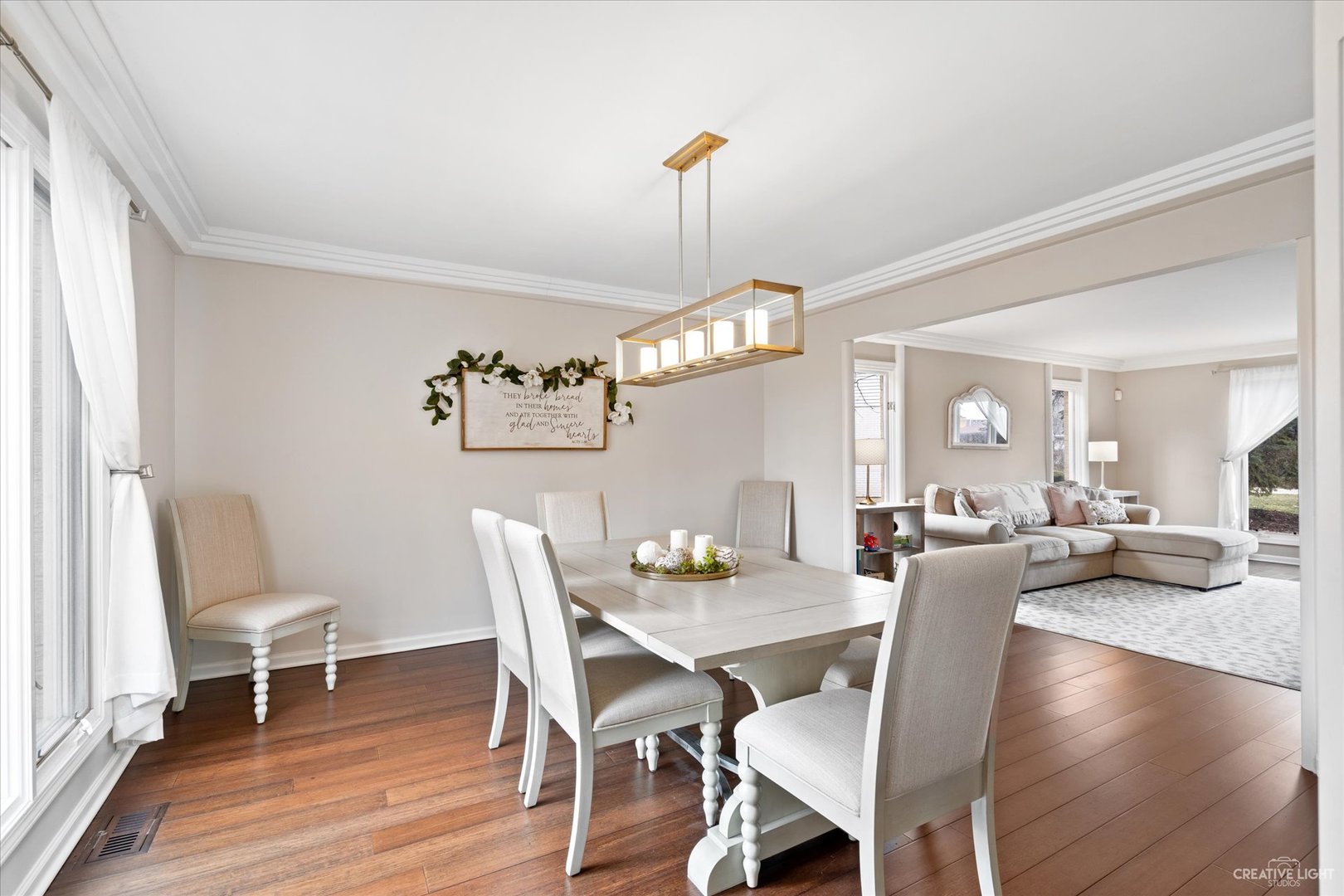 734 Forest Glen Lane Oak Brook, IL 60523 - Photo 8 of 36 a view of a dining room with furniture a chandelier and wooden floor