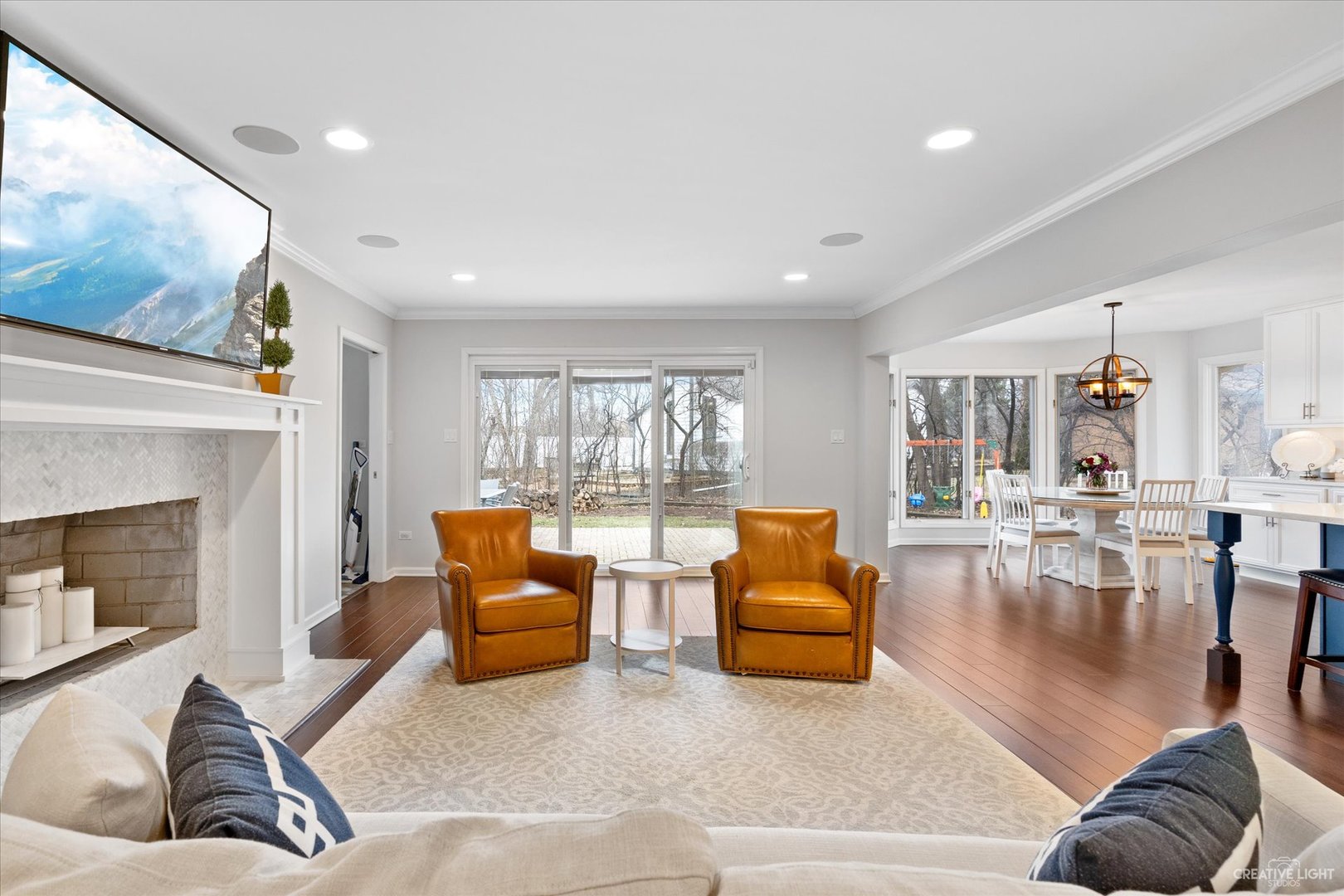 734 Forest Glen Lane Oak Brook, IL 60523 - Photo 10 of 36 a living room with furniture and a fireplace