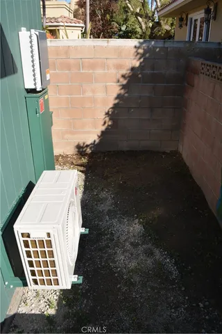 a bathroom with a tub shower and mirror