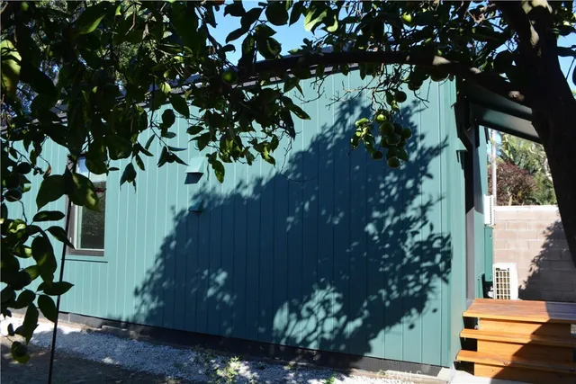 a backyard of a house with lots of green space