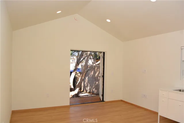 a kitchen with a refrigerator and a sink