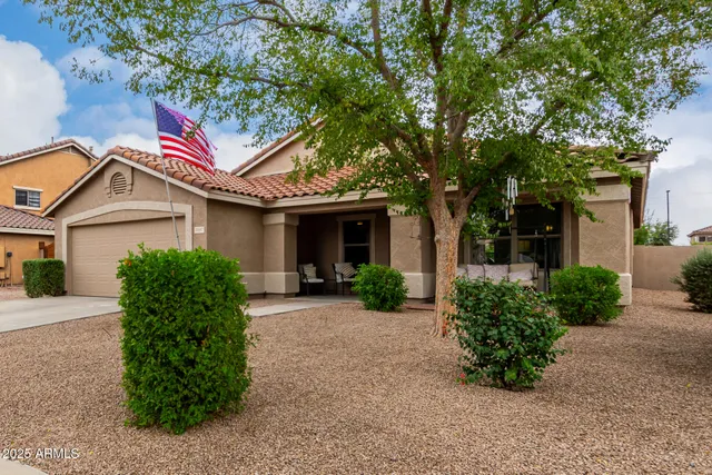 front view of a house with a garden