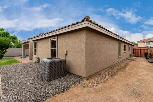 a view of a backyard with sitting area