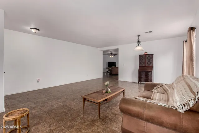 a living room with furniture and a table