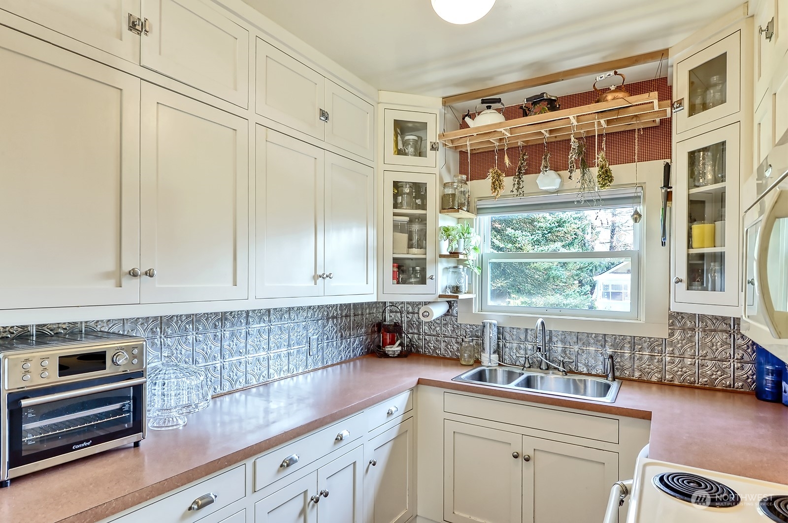3315 South Pass Road Everson, WA 98247 - Photo 18 of 40 a kitchen with stainless steel appliances a sink a stove and a window