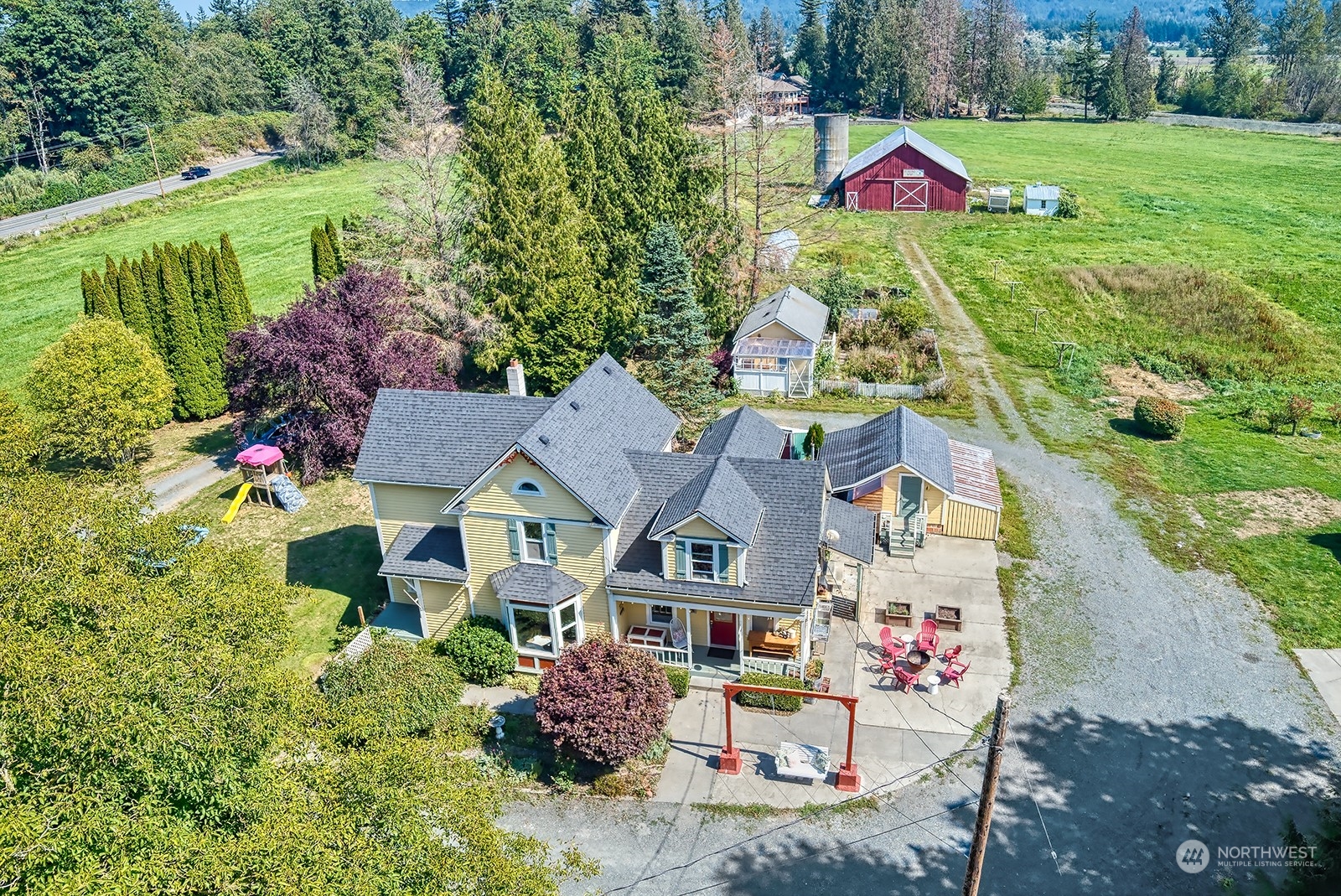 3315 South Pass Road Everson, WA 98247 - Photo 3 of 40 a view of a house with a big yard and large trees