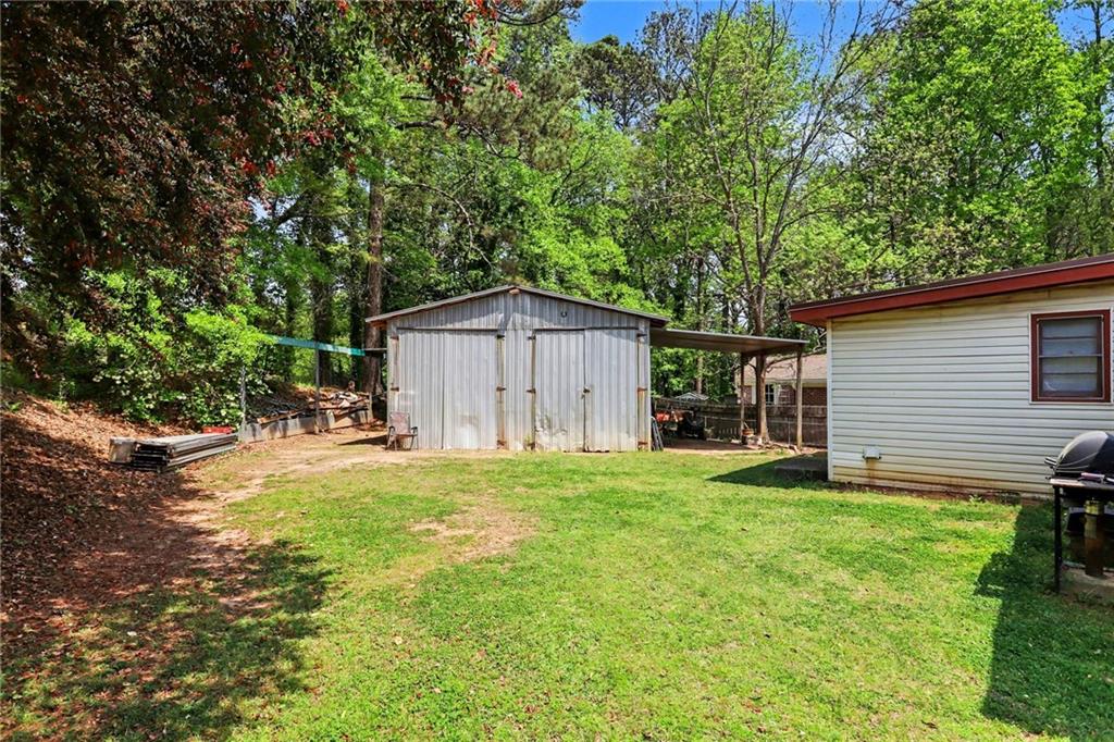 7019 Lake View Lane Doraville, GA 30360 - Photo 32 of 32 a house view with a sitting space and garden