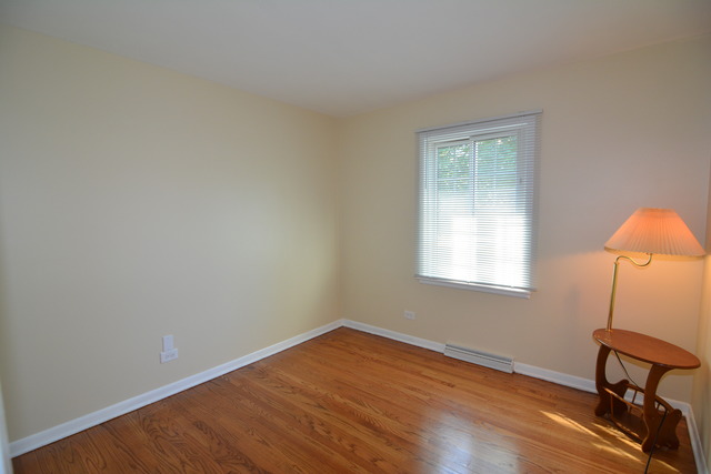 716 Lisa Road West Dundee, IL 60118 - Photo 12 of 18 a room with a window and wooden floor