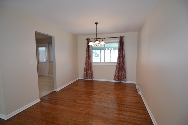 716 Lisa Road West Dundee, IL 60118 - Photo 4 of 18 a view of empty room with wooden floor and fan