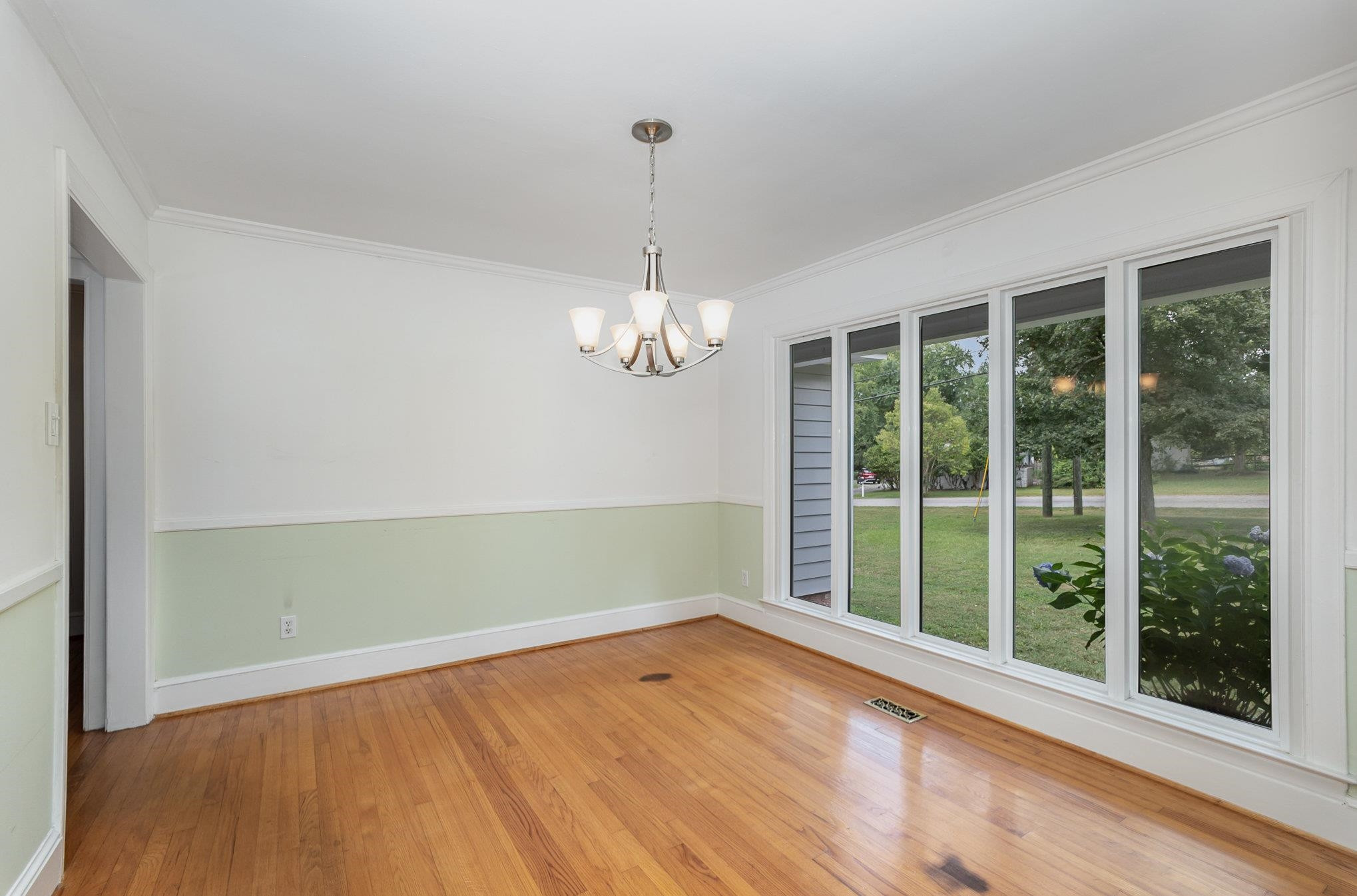 3210 Timberlake Road Raleigh, NC 27604 - Photo 16 of 43 a view of empty room with wooden floor and fan