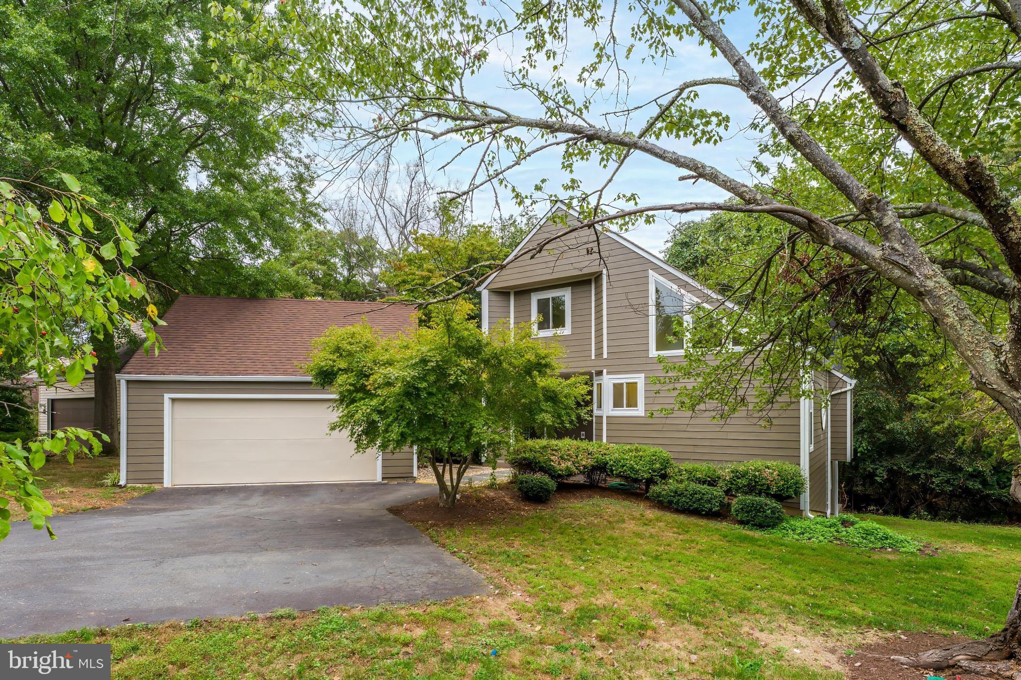 11916 Moss Point Lane Reston, VA 20194 - Photo 1 of 43 a house that has a tree in front of it