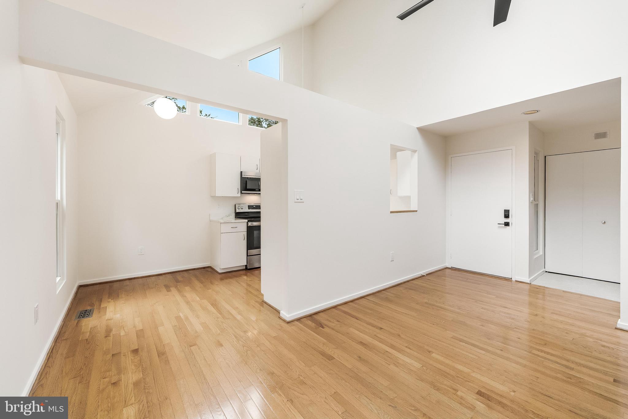 11916 Moss Point Lane Reston, VA 20194 - Photo 19 of 43 a view of empty room with wooden floor and window