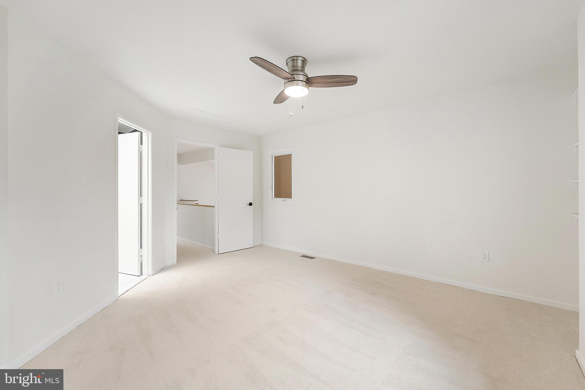 11916 Moss Point Lane Reston, VA 20194 - Photo 32 of 43 an empty room with closet and windows