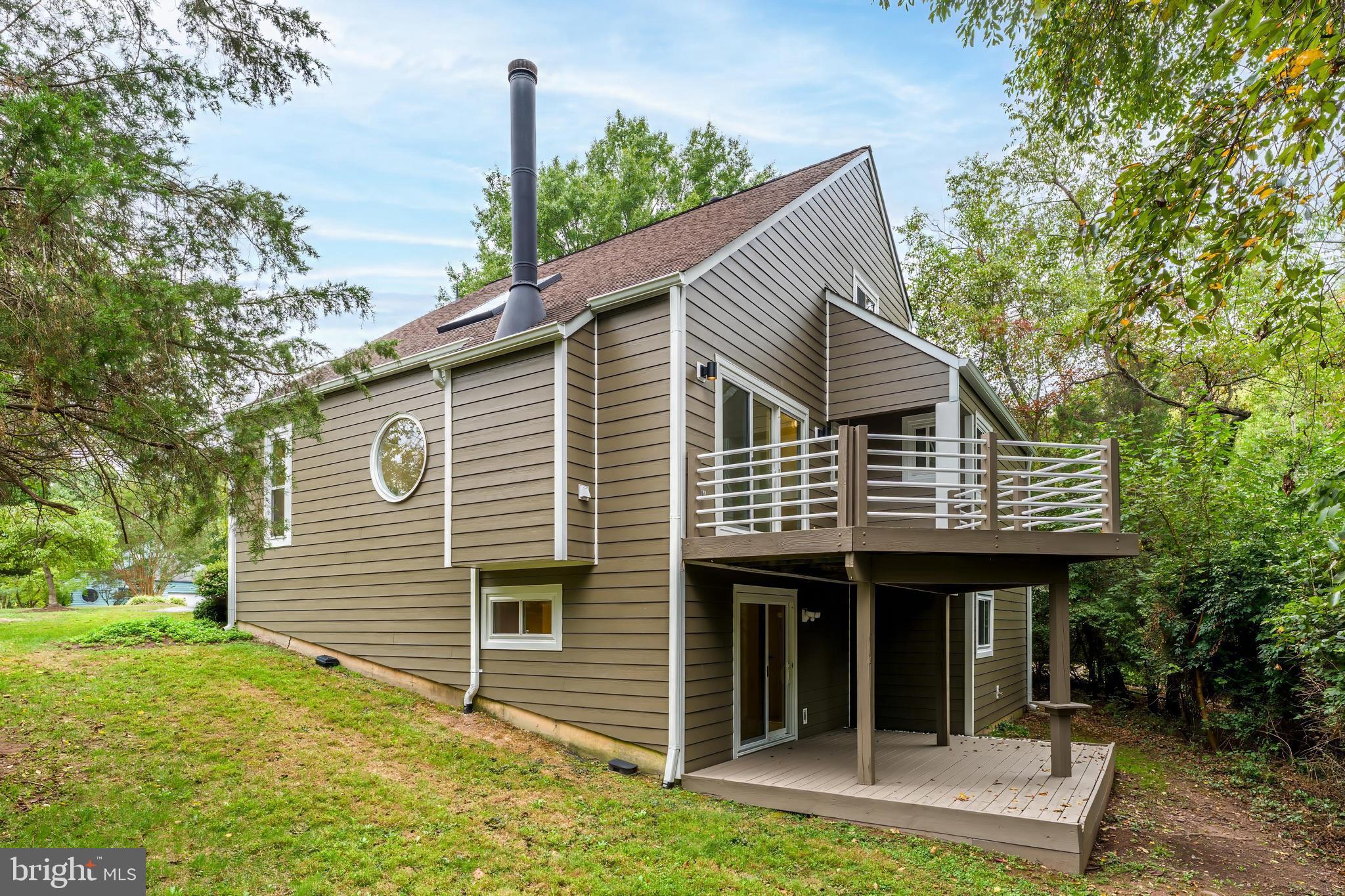 11916 Moss Point Lane Reston, VA 20194 - Photo 40 of 43 a front view of a house with garden