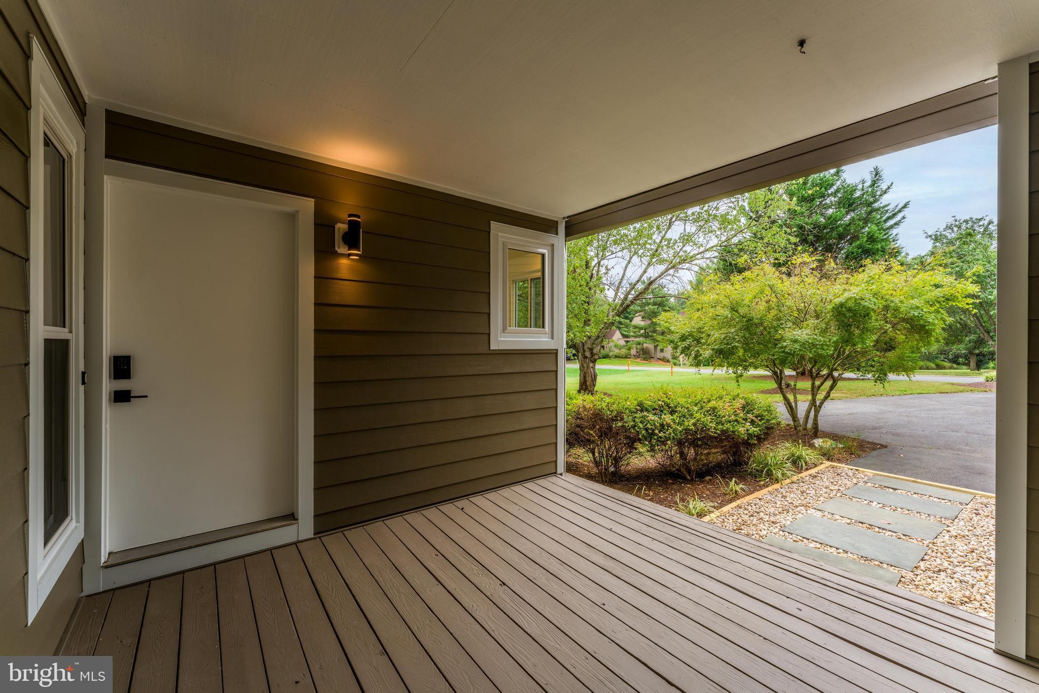 11916 Moss Point Lane Reston, VA 20194 - Photo 4 of 43 a view of a porch with wooden floor and outdoor space