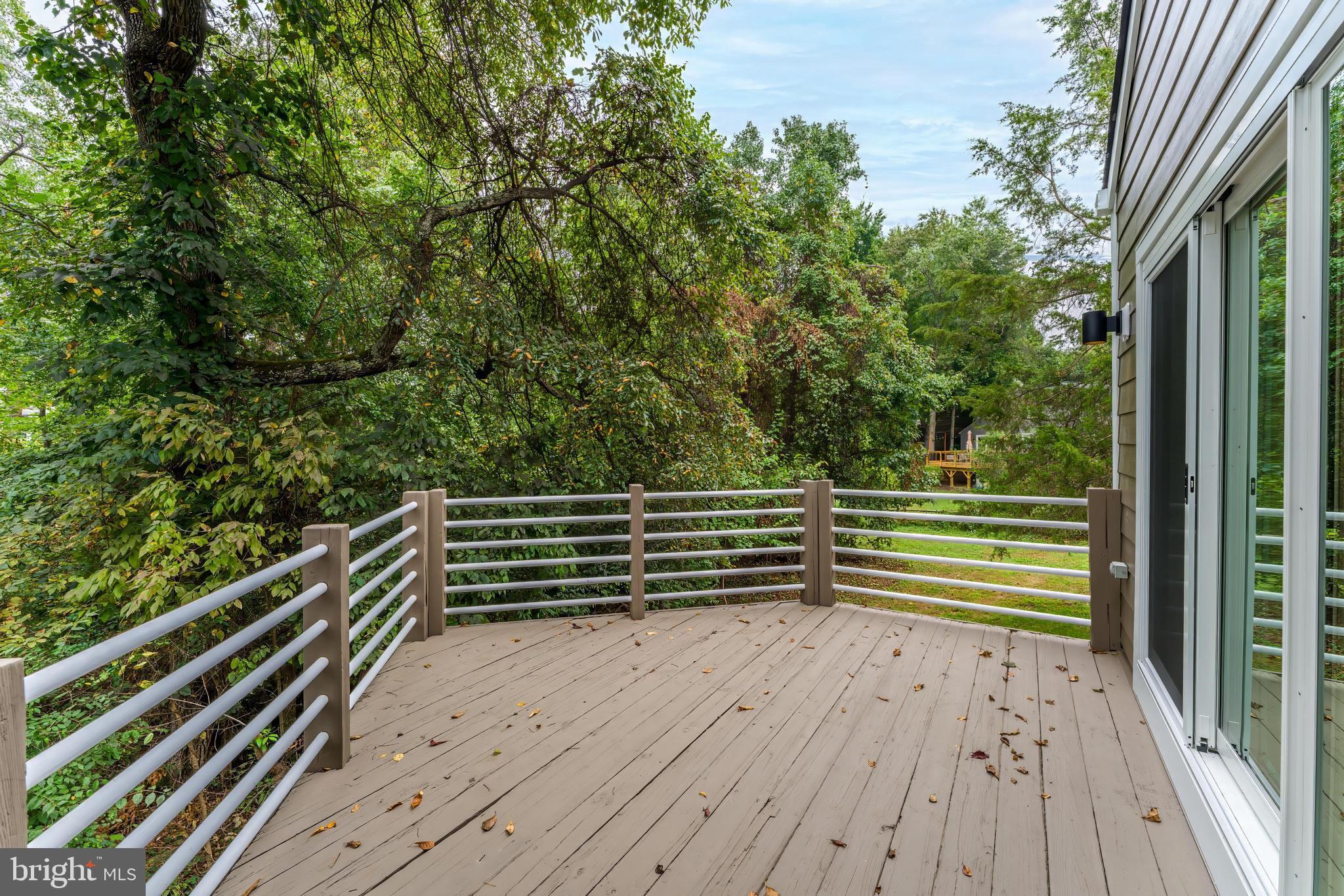 11916 Moss Point Lane Reston, VA 20194 - Photo 41 of 43 a view of outdoor space with deck and trees