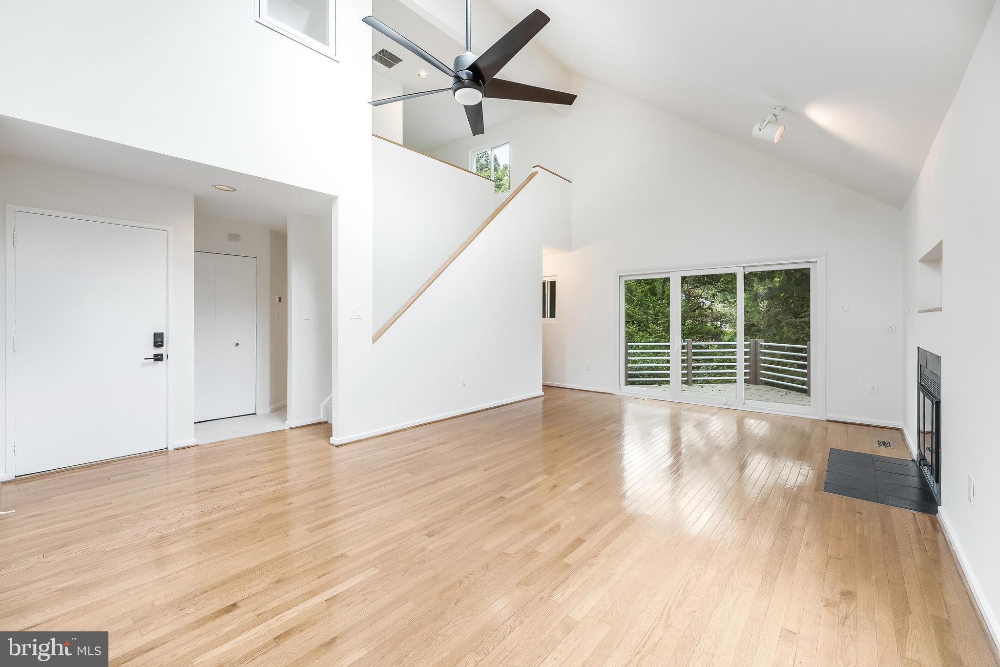 11916 Moss Point Lane Reston, VA 20194 - Photo 7 of 43 a view of an empty room with wooden floor and a window