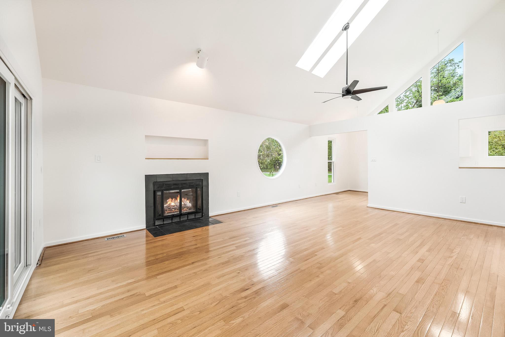 11916 Moss Point Lane Reston, VA 20194 - Photo 9 of 43 a view of a room wooden floor and a fireplace