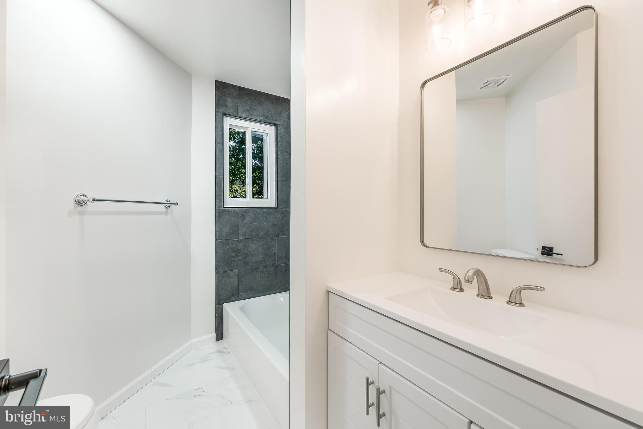 11916 Moss Point Lane Reston, VA 20194 - Photo 10 of 43 a bathroom with a sink and a mirror