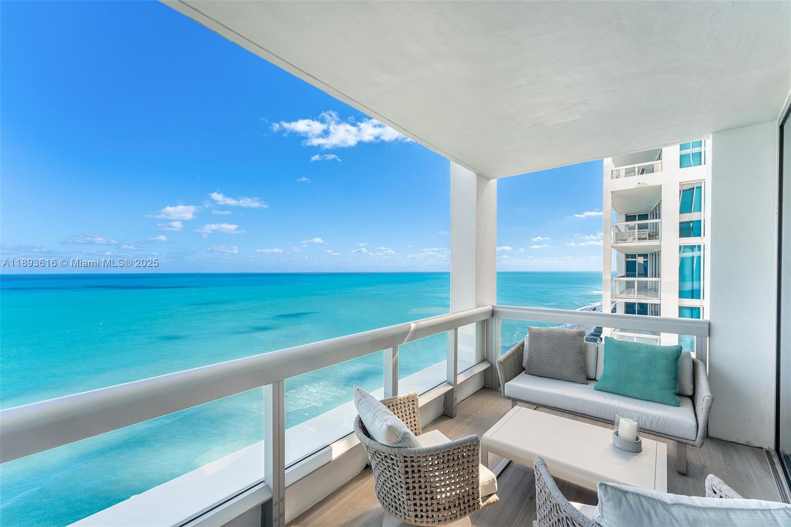 6899 Collins Avenue, Unit 2601 Miami Beach, FL 33141 - Photo 13 of 70 a balcony with furniture