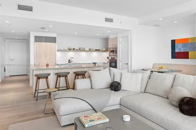 a room with a bed and a large window