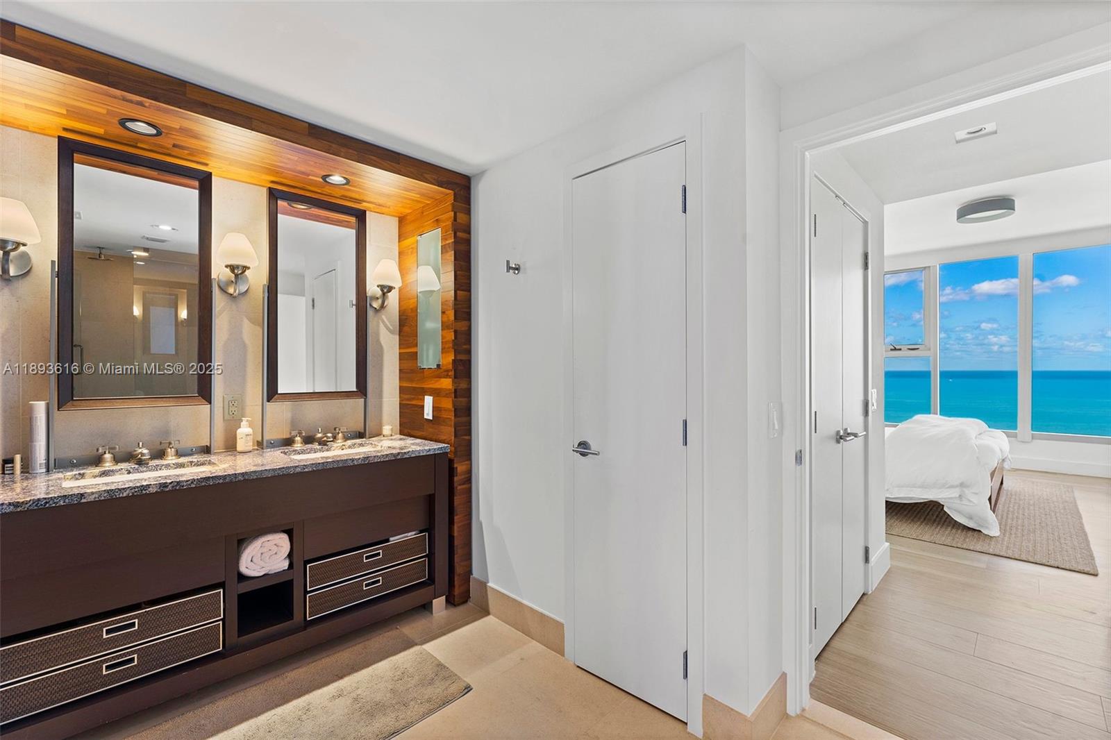 6899 Collins Avenue, Unit 2601 Miami Beach, FL 33141 - Photo 18 of 70 a room with a bed and a large window