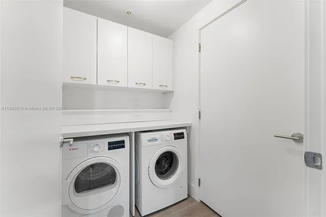 a living room with furniture and floor to ceiling windows