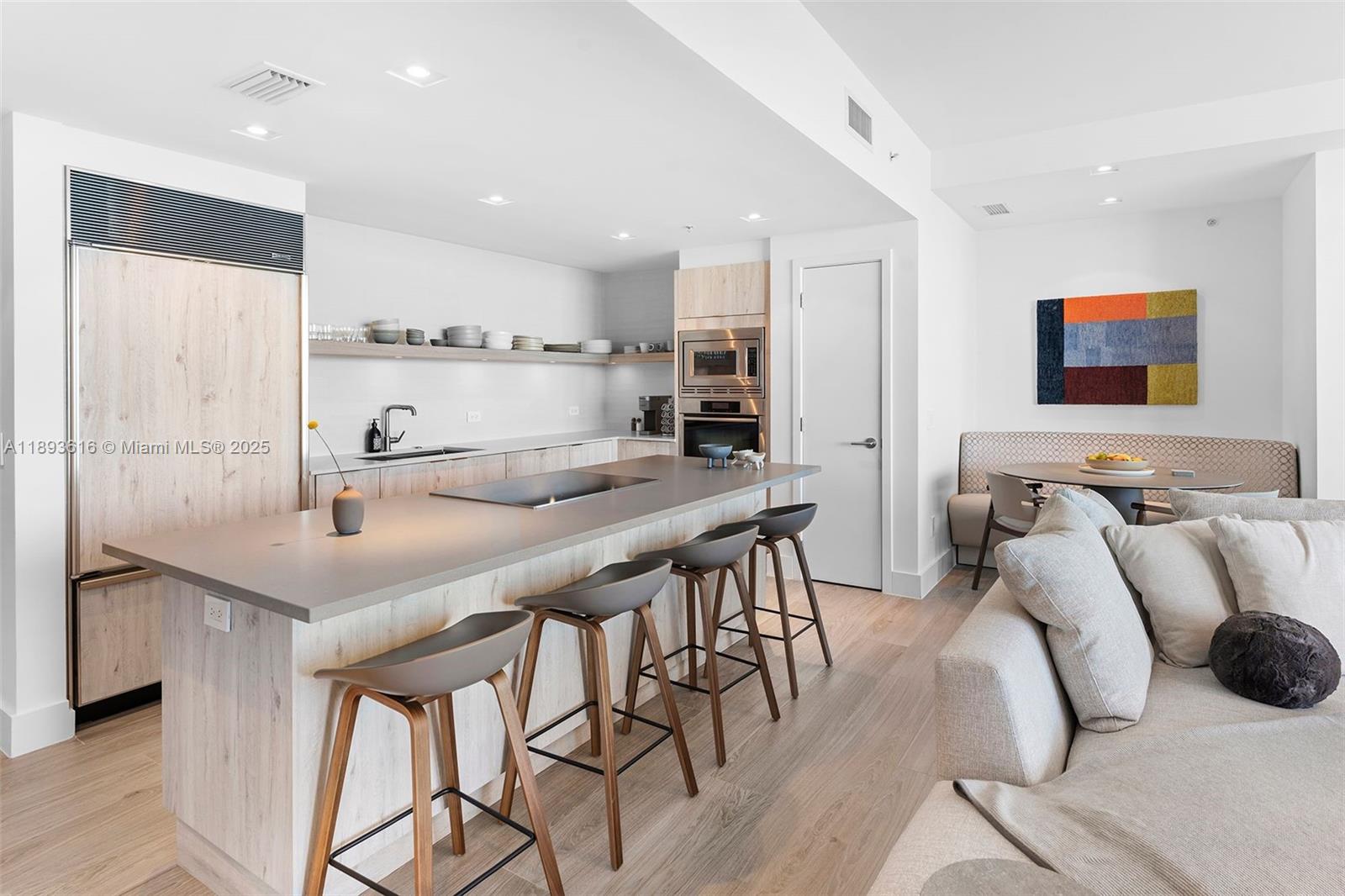 6899 Collins Avenue, Unit 2601 Miami Beach, FL 33141 - Photo 26 of 70 a kitchen with stainless steel appliances kitchen island granite countertop a sink and cabinets