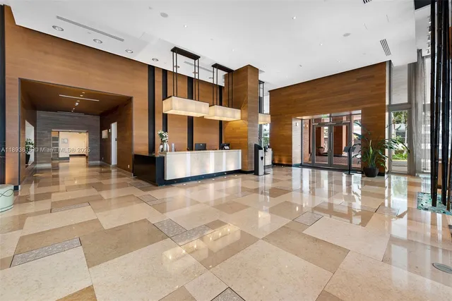 front view of a building with a tree