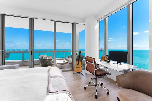 a view of patio with a table and chairs and potted plants