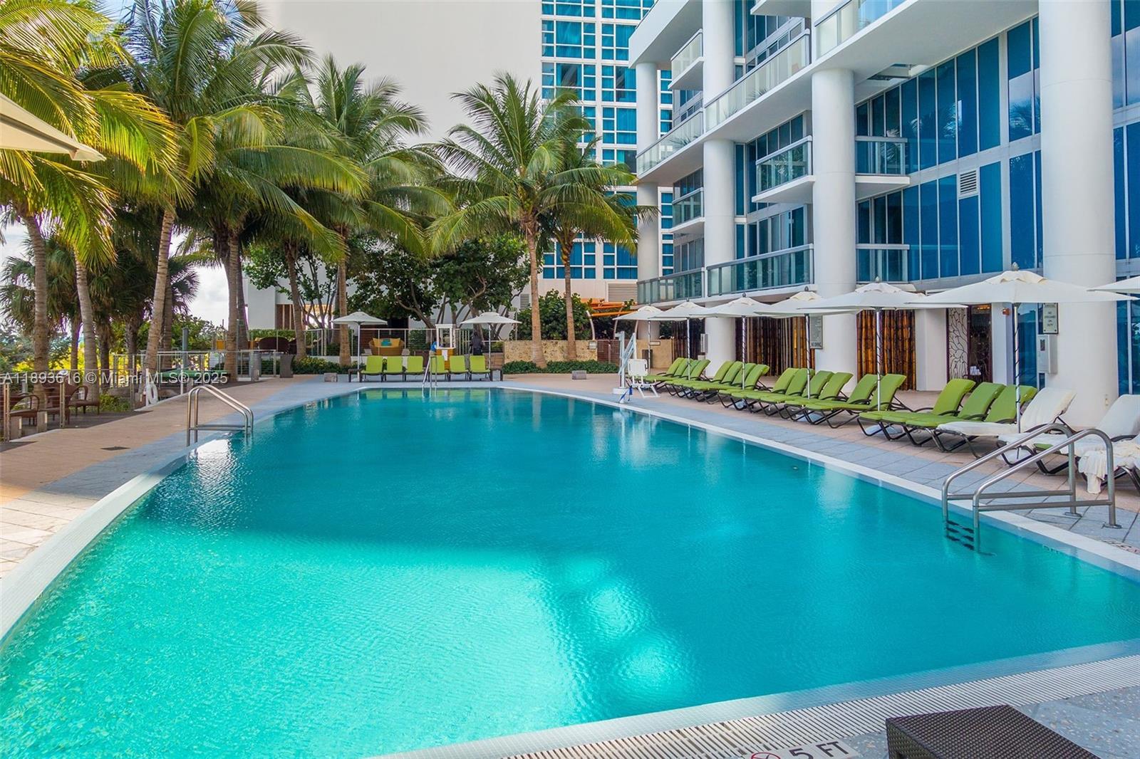 6899 Collins Avenue, Unit 2601 Miami Beach, FL 33141 - Photo 48 of 70 a swimming pool view with a outdoor seating