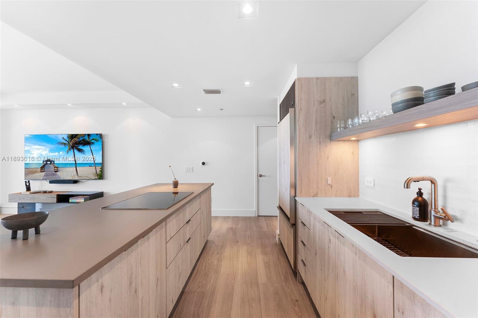 6899 Collins Avenue, Unit 2601 Miami Beach, FL 33141 - Photo 7 of 70 a kitchen with sink and view