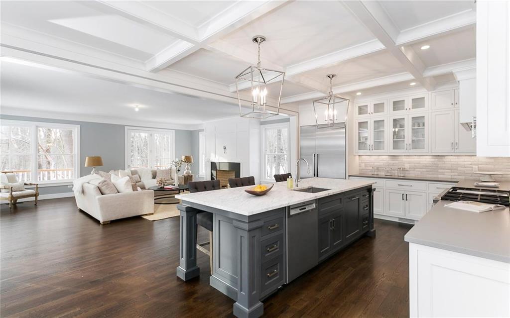 a kitchen with a stove a sink and a refrigerator
