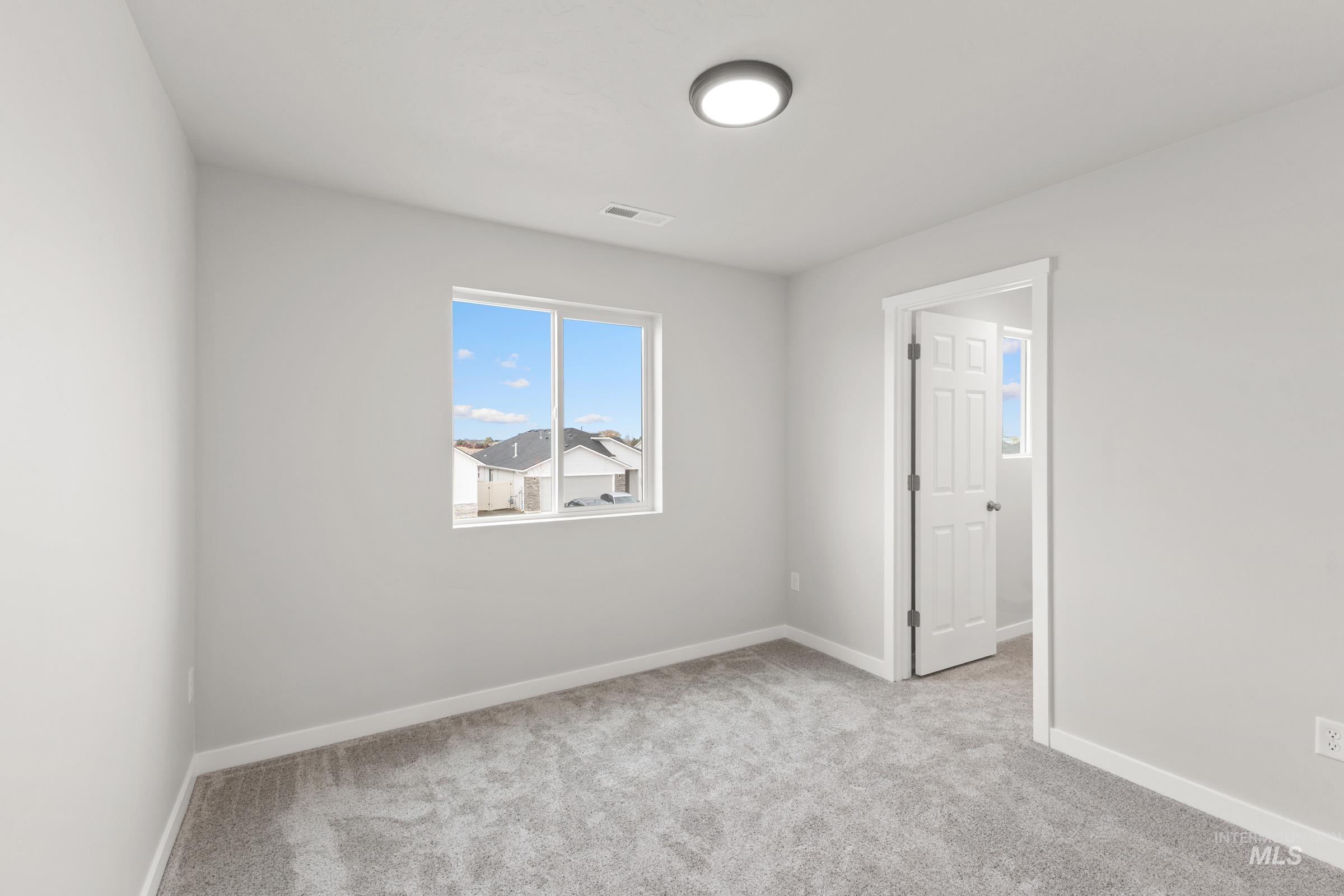 461 Waverly Avenue Middleton, ID 83644 - Photo 14 of 22 Unfurnished room featuring light carpet and baseboards