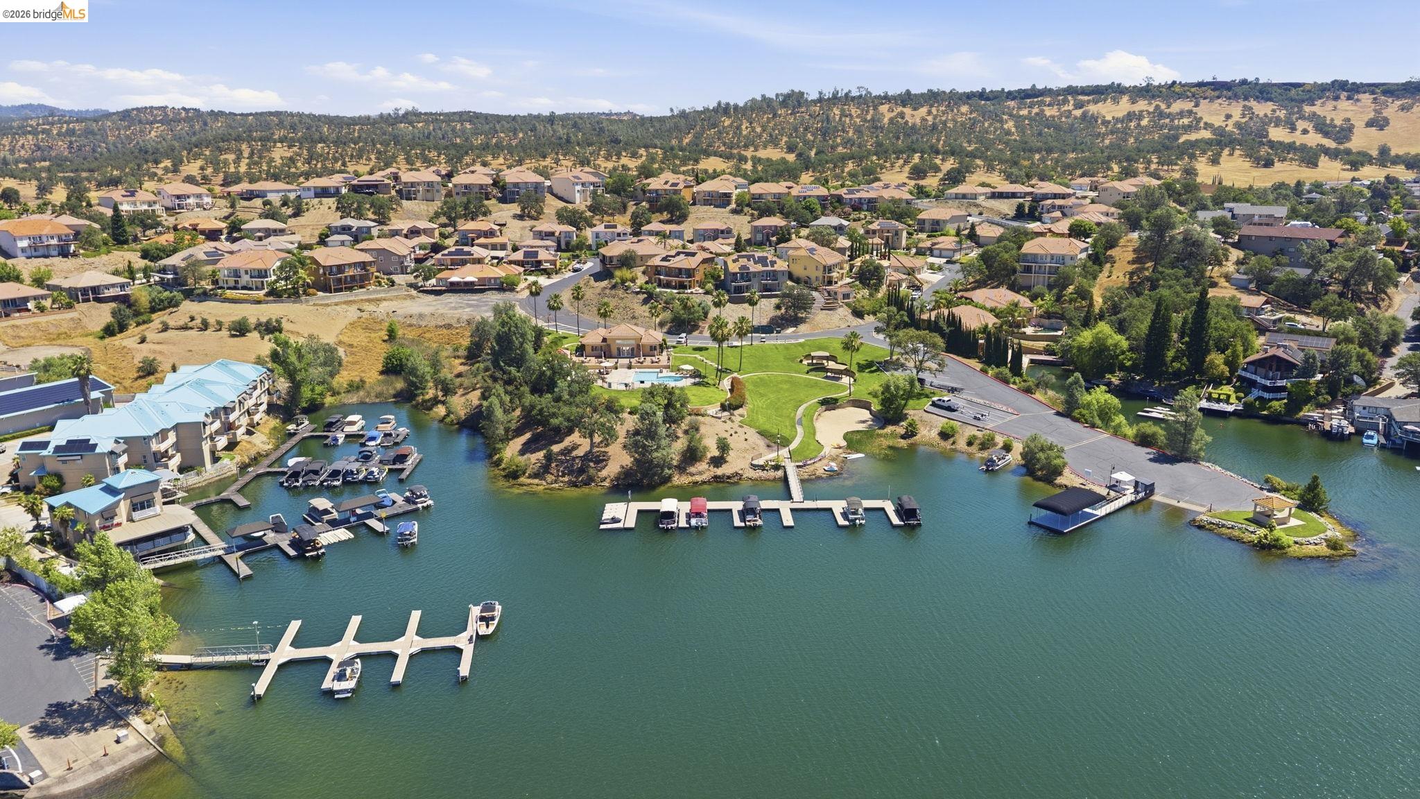 6242 Bluff View Road Copperopolis, CA 95228 - Photo 58 of 59 Waterfront community featuring multiple boat docks, a boat ramp, and expansive green spaces