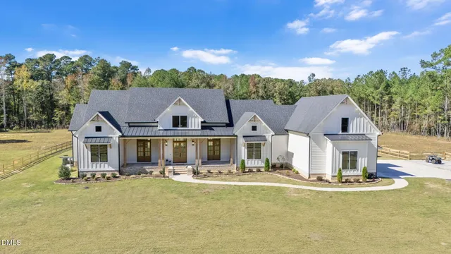 an aerial view of a house with swimming pool