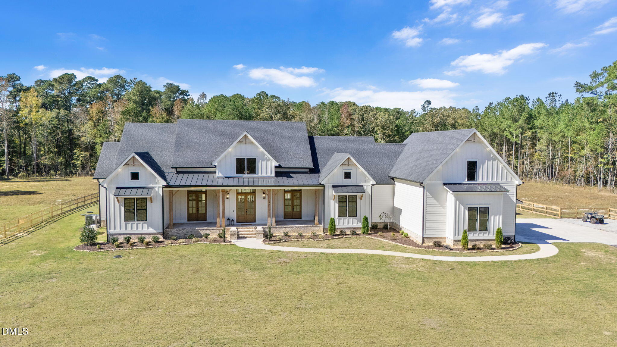 an aerial view of a house with swimming pool