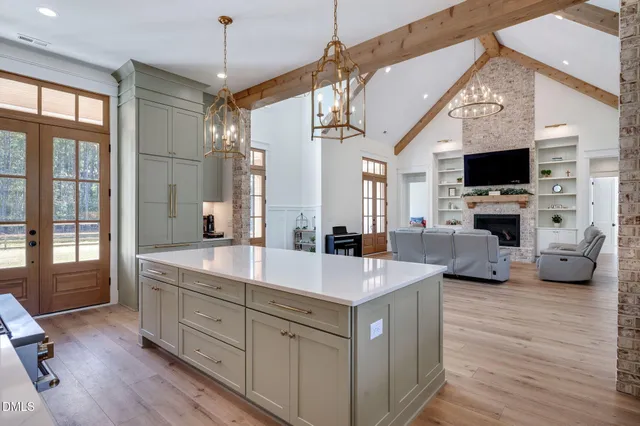 a spacious bathroom with a tub sink and mirror