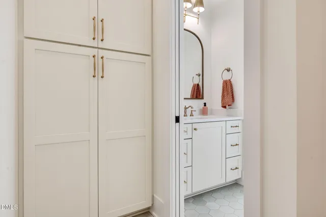 a view of kitchen with furniture and refrigerator