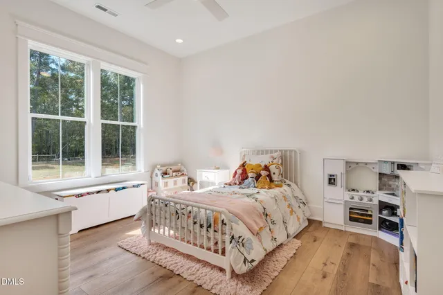 a kitchen with stainless steel appliances granite countertop a stove and a white refrigerator