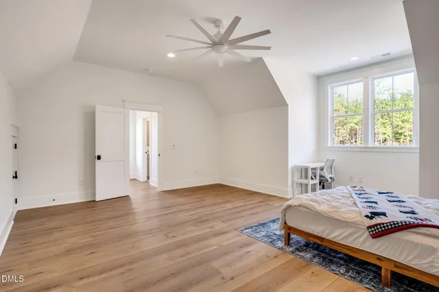 a view of a house with swimming pool and a yard