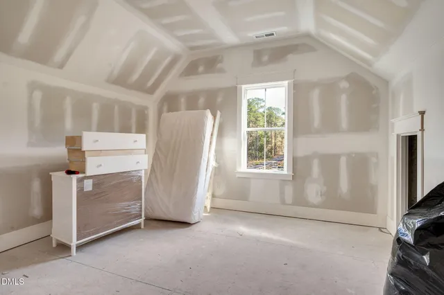 a view of a park with large trees