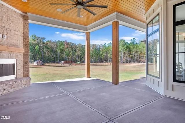 an aerial view of a house with outdoor space